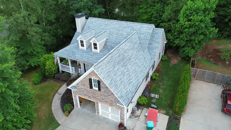 Aerial view of a completed architectural shingle roof replacement on a two-story North Georgia home
